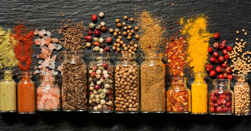 mix of spices in overturned glass vials